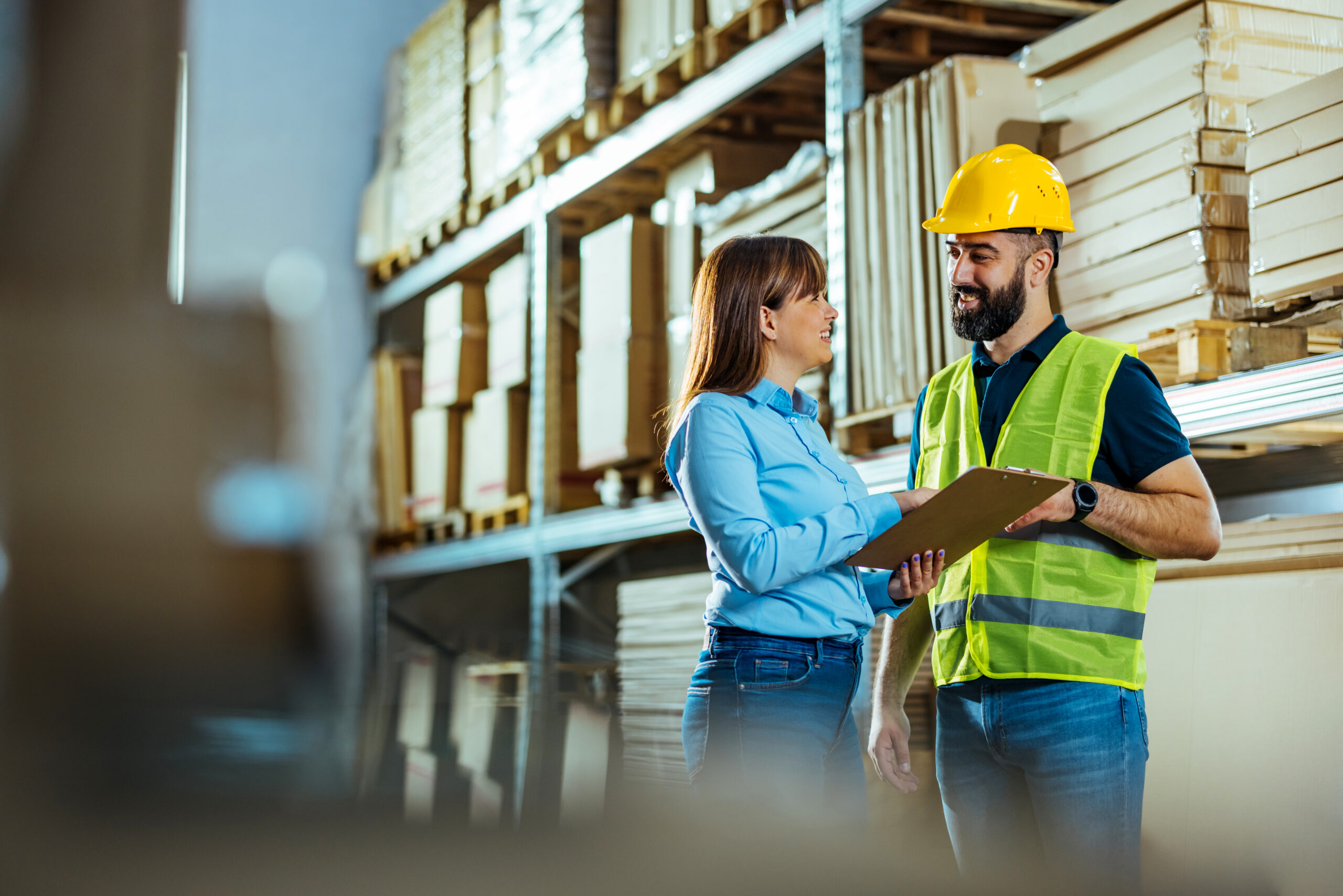 Manger discussing warehouse stocks with supervisor